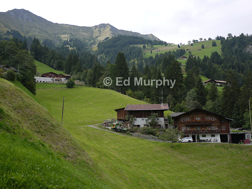 Descending into Frutigen with the three peaks above