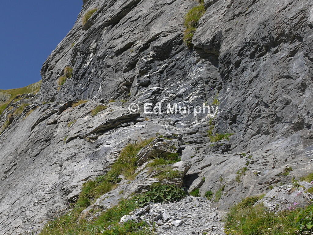 Negotiating cliffs on the way to the Gleckstein Hut