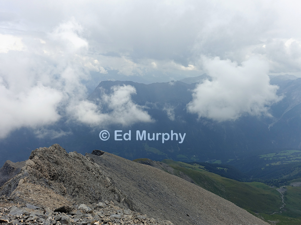 Unstable weather towards Scuol from the summit of the Muttler